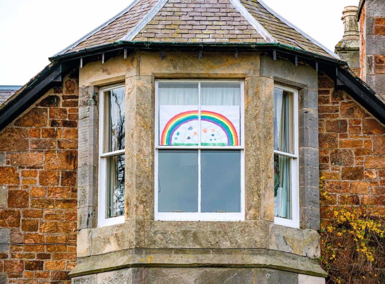 A house with a sign in front of it that says not haunted and your sign here A house with a sign in front of it that says not haunted and your sign here